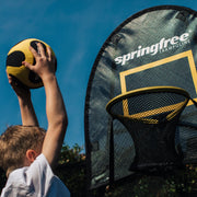 Boy Playing Basketball on Springfree Compact Round Trampoline R54