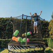 Boy Jumping on Springfree Compact Round Trampoline R54