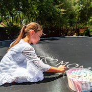 Girl Writing With Chalk On Springfree Large Oval Trampoline O92 