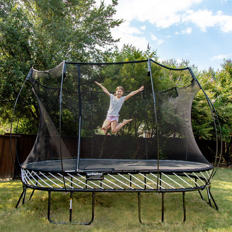 Girl Jumping On Springfree Large Oval Trampoline O92 